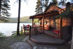 Enjoy this charming log cabin with large deck and BBQ overlooking the water